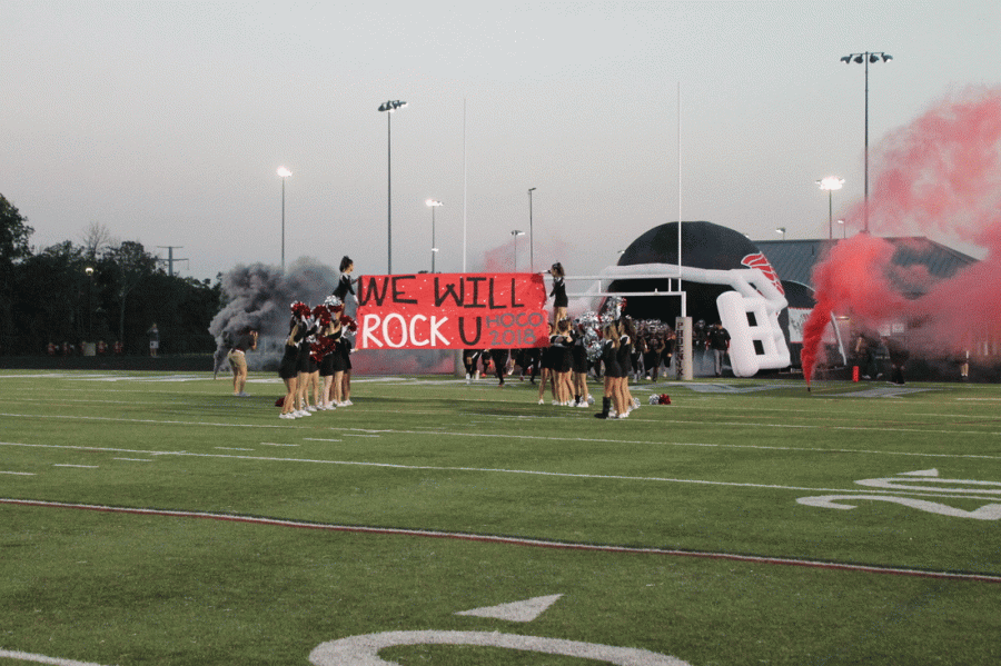 The Rock Ridge Football team emerges, ready to play Freedom.