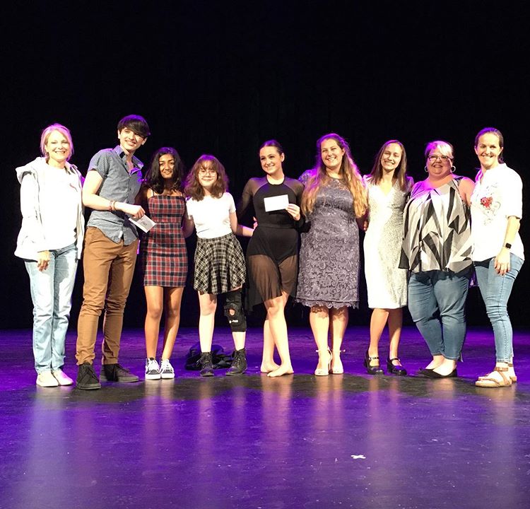  (From left) Social studies teacher Melissa Pruitt, runner up junior Trey Launder, freshman Anna Nguyen and Dhaya Bharath; winners of People’s Choice Awards, winner junior Elle Ouimet, along with hosts junior Courtney Bergeron and senior Katie Howard, theater director Katie Rivers and French teacher Veronique Billington, pose for a picture at the end of the talent show.
