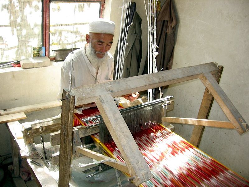 In 2005, an elderly Uyghur man weaves traditional Atlas silk, which is used in Uyghur women’s clothing. 