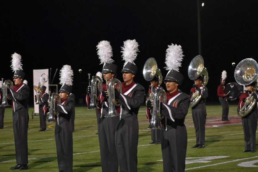 The Marching Band takes the field at the Homecoming Game Friday night during the second half. 