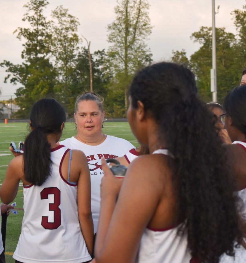 Michelle Federico coaches the varsity field hockey team in the Phoenix v. Patriots match on Oct. 5 at the Rock. As head coach, she wants more girls to be interested in a sport like field hockey. “[Field hockey has] always been my favorite sport,” Federico said, “It’s unique, it’s hardcore. People dont realize how difficult it is.”