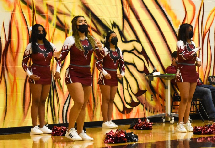 On Jan. 24, Phoenix cheerleaders sophomore Isha Vepa, junior Tia Carter, freshman Almendra Del Aguila, and junior Prerana Telugu perform a cheer in unison at the basketball game against Tuscarora. “We almost got hit by a ball like two [or] three times, we just kinda stepped back and kept watching. We literally laughed about it afterwards -- it’s always fun to support with these wild things happening.” said Telugu.
