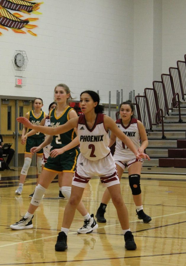 Focused and not backing down, sophomore Cora Bowen guards the Vikings alongside senior Alexa Veneros as the game comes to a close.