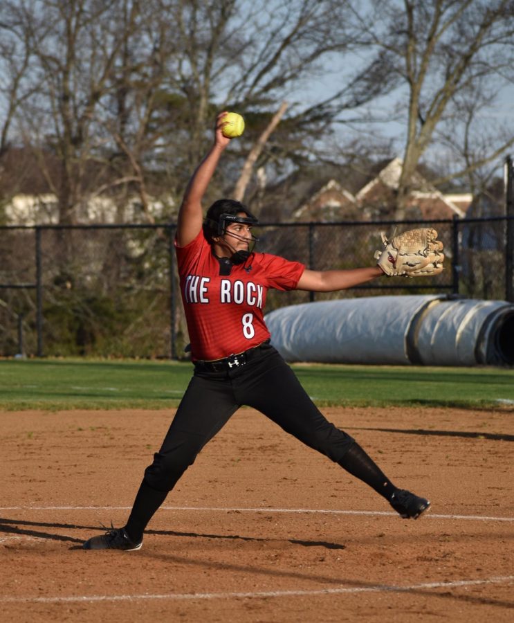 In the first inning of the game, captain junior Rishita Valluru (8) pitches the ball to the starting Falcon batter.