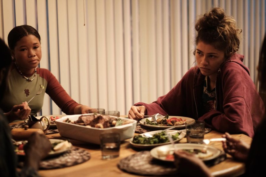 Rue and Gia are reunited with Rue’s support system, Ali (Colman Domingo, not pictured), presence at the dinner table following her estrangement from him.
