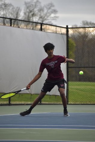 Freshman Kaushik Muskari prepares to hit the ball in his singles match. “I think I could’ve done a lot better,” Muskari said, “and of course there’s always a lot of room to improve, knowing that Im still learning.”
