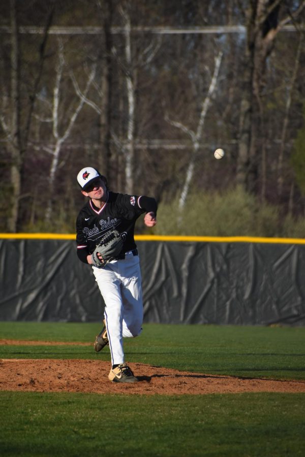 Junior Peytan Sutherland (10) pitches a knuckleball to throw off Tuscarora’s batter.
