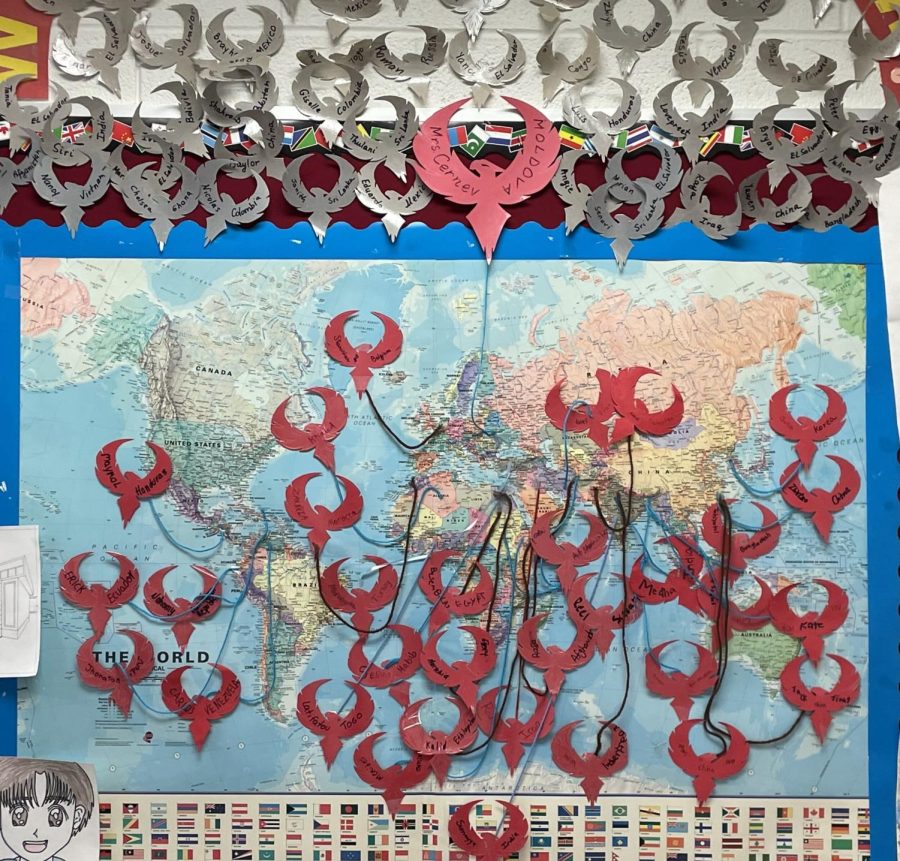 A map in EL teacher Margareta Cernev’s room shows the names and countries of origin, written on the red phoenixes, of her current EL students. Above the map, the names and countries of origin of Cernev’s previous students, who have graduated from high school, are displayed on gray phoenixes.