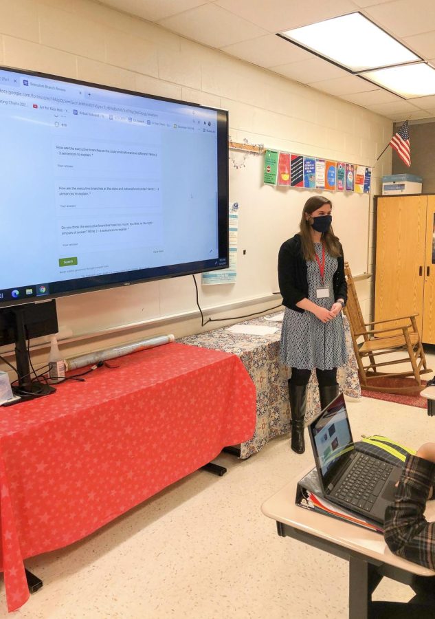 While reviewing the concept of federalism, senior Danielle  Knick oversees a Google form questionnaire activity. “After the students finished the activity, I called on three students to explain their answers,” Knick said. “During this activity, I got to practice the important skills of classroom management and student assessment.”