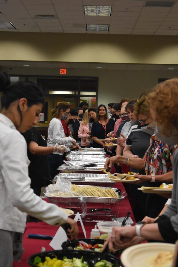 Teachers line up in the library to grab their free lunch provided by the PTSO on May 5.