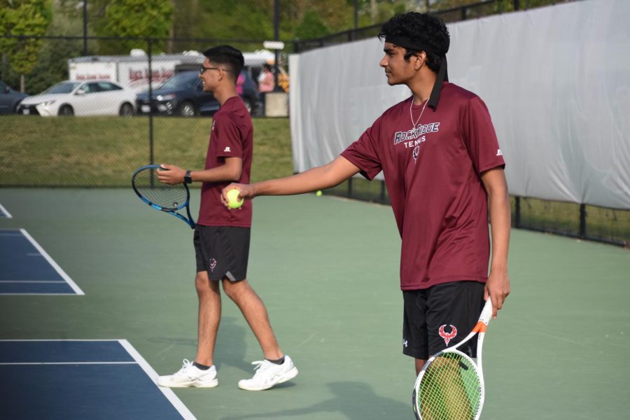 Senior+Anish+Nandyala+prepares+to+serve+during+the+doubles+matches%2C+with+partner+sophomore+Aryan+Dhiman+ready+to+play.