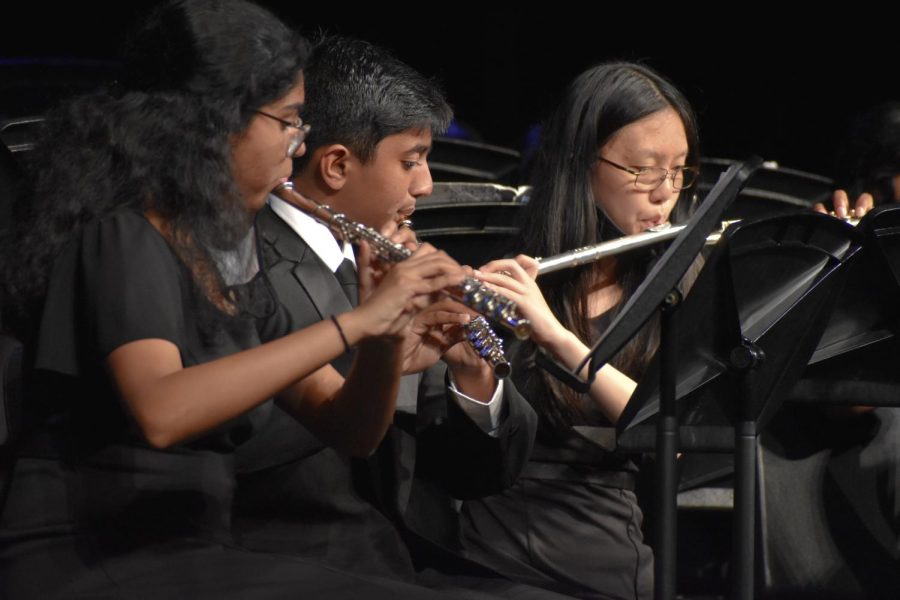 Junior Sneha Nekkanty, freshman Arjun Alagappa, and junior Joanne Ma play the flutes in Ralph Vaughan William’s fast-paced “English Folk Song Suite.” “We did well blending with each other during this concert,” Nekkanty said. “Our intonation was also better [compared to] the beginning of the year.”