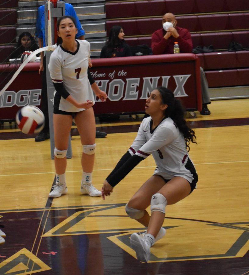 Junior Ankita Kamath (9) lunges towards the ball to prevent it from hitting the ground. “I think the last time we played Broad Run, it was a lot closer than expected, so we really wanted to go in and kill them,” junior Kamath said.