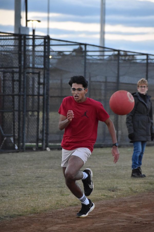Senior Srikar Bangaru runs to homebase as the Juniors chuck the ball at him to get him out. “I wanted to play because it is my senior year and I want to make the most out of the opportunities I have left in high school to have fun and make memories,” Bangaru said.