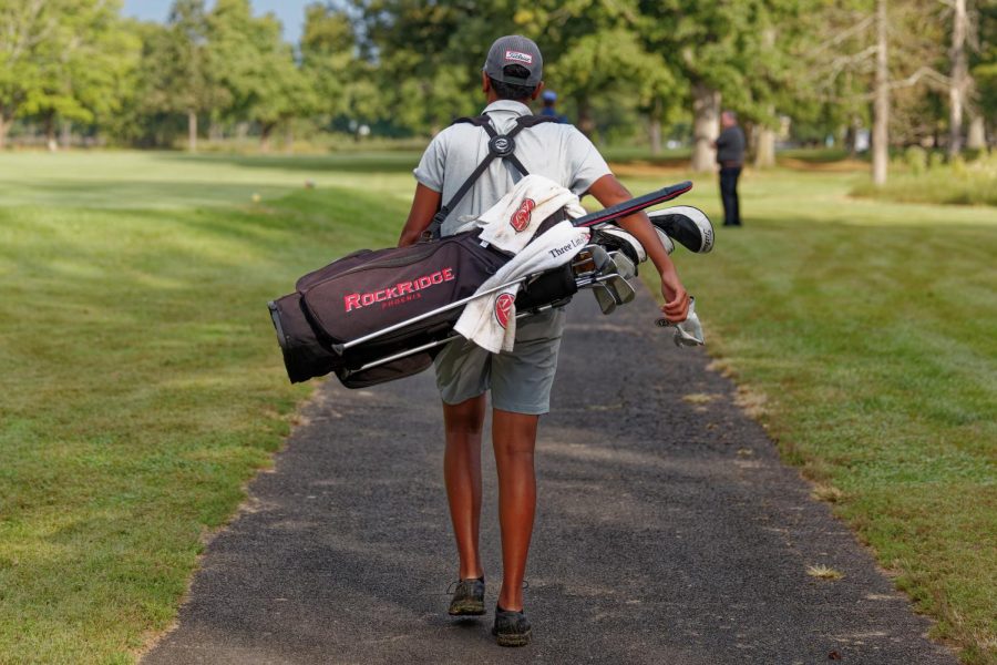 Leaving the season behind, sophomore Aiden Patel walks along a golf course holding all his golf equipment. Patel, although not yet a senior, is already thinking about his future in golf. “Hopefully, [I’ll continue golf] in college, and if I can go pro, a 100%,” Patel said, “But if I cant, Ill probably just find a job.”