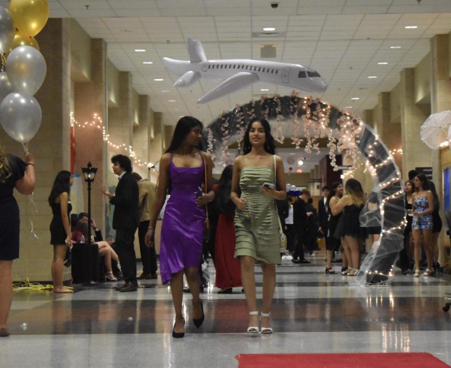 Sophomores Nivi Mohan and Nishitha Kancharla walk towards the exit doors of the main hallway. After a night full of energetic dancing, singing and a lot of fun, students were ready to go home.
