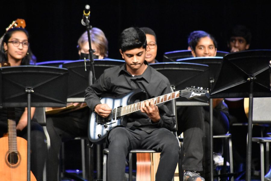 Maneesh Getni strums the guitar, capturing everyone’s attention with his electrifying solo.