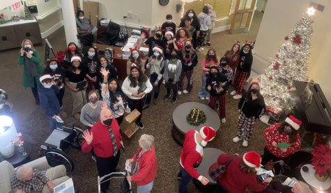 Rock Ridge Choir poses after performing for the residents of Waltonwood senior center.