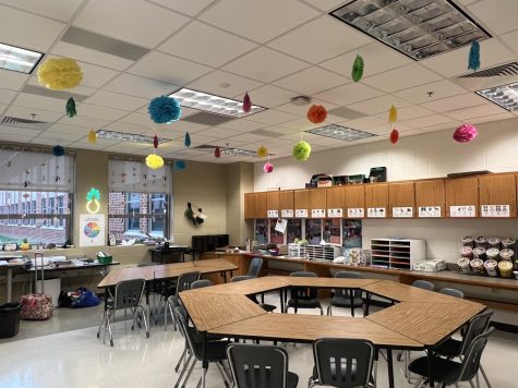The classroom of L503, where the course takes place, is designed to look and feel like a preschool or kindergarten level classroom. It’s colorful and filled with decorations, arts and crafts, board games, and more -- all to simulate that early childhood feel. Some of the items in the room come from both students and little ones from the Head Start Program.