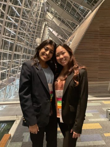Fresh from placing 4th on March 5, 2022 at SLC (State Leadership Conference) in the Project Management Career Development category, Emily Lam (right) poses with her friend, senior Nina Lal (left),  in celebration of both of their successes.