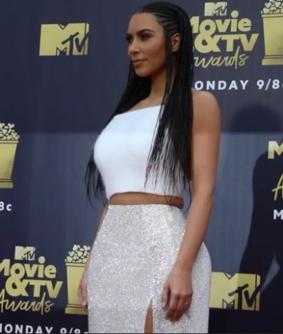 During the 2018 MTV Movie and TV Awards, businesswoman and socialite Kim Kardashian wore a new hairstyle, cornrows, drawing controversy and criticism from some of her followers. “I actually did that look because North said she wanted braids and asked if I would do them with her. So we braided her hair and then we braided my hair,” Kardashian said to Bustle. (An earlier version of an image for this piece was taken down due to unclear copyright requirements)