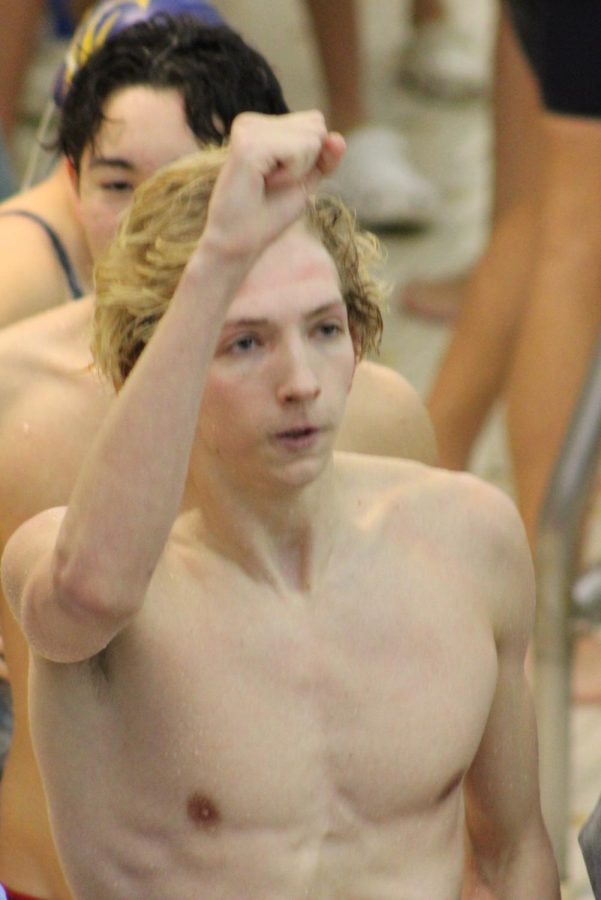 Senior+Morgan+Fowle+celebrates+after+winning+his+50+yard+freestyle+heat+at+the+county+championships+on+Jan.+14.+Most+of+Fowle%E2%80%99s+preparation+prior+to+races+is+mental.+%E2%80%9CI+try+to+visualize+my+races+step+by+step+and+frame+by+frame+to+help+me+get+a+better+feel+for+how+the+race+is+going+to+unfold%2C%E2%80%9D+Fowle+said.