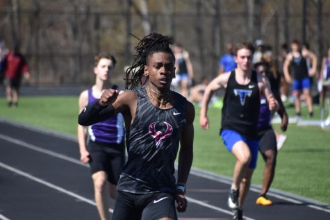 Senior Kamaal Reel races in the 100m dash, setting a school record with a time of 11.08 seconds. “I was just proud of myself, since I’ve had that goal ever since I started here,” Reel said. 