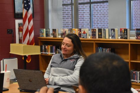 Smiling at the board, Student Activities and Engagement Coordinator Annamika Hacikyan discussed specific information about the PTSO Pep Rally.
