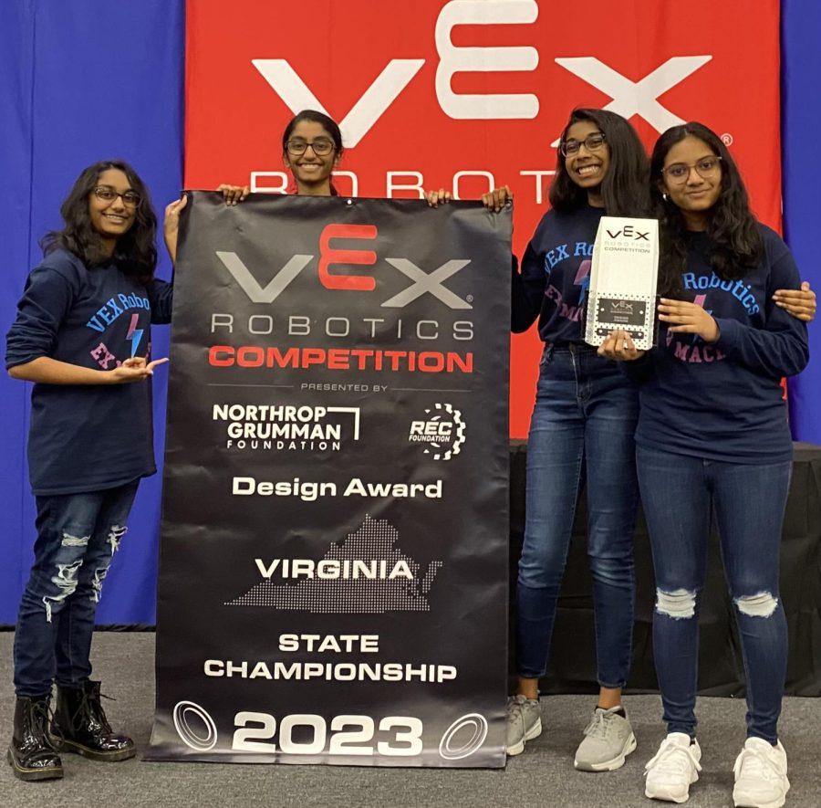 The Ex Machina team stands in front of a banner as they receive the 2023 Designer Award for their outstanding effort and the cleanliness in their programming notebook.