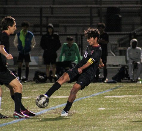 Sophomore Rishit Choudhari sets up to pass the ball while teammates attempt to get open. “Right now we’re in a good spot, our goal is to just keep improving as the season goes,” Choudhari siad.