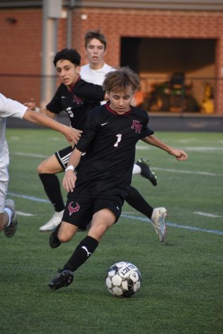 Junior Carter Divalerio dribbles the ball to keep it away from Captains. “It was a rough season, there were some ups and downs, we took some Ls, but well bounce back next season,” Divalerio said.