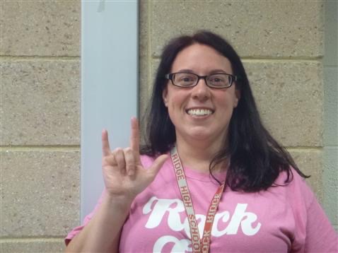 Elizabeth Bush holds up the “I love you” sign in ASL for her staff photo on the RRHS website. Photo courtesy of Elizabeth Bush.
