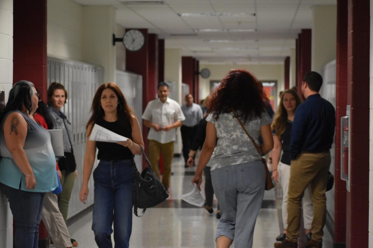 Parents walk through the halls looking for their child’s fourth block classroom. Throughout the event, Phoenix staff members such as counselor Kasandra Wilson were able to meet and guide parents throughout the building. “It is a long day,” Wilson said. “But, I’m willing to do it to see the parents and meet the student’s family.”