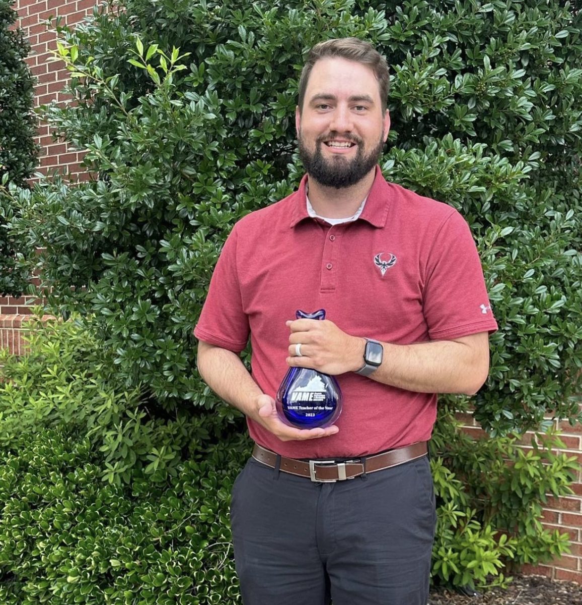 Marketing teacher Ben Stodola holds his VAME Teacher of the Year Award with pride. “I enjoyed reflecting on things that I have done over the past couple of years,” Stodola said. Photo courtesy of Ben Stodola.