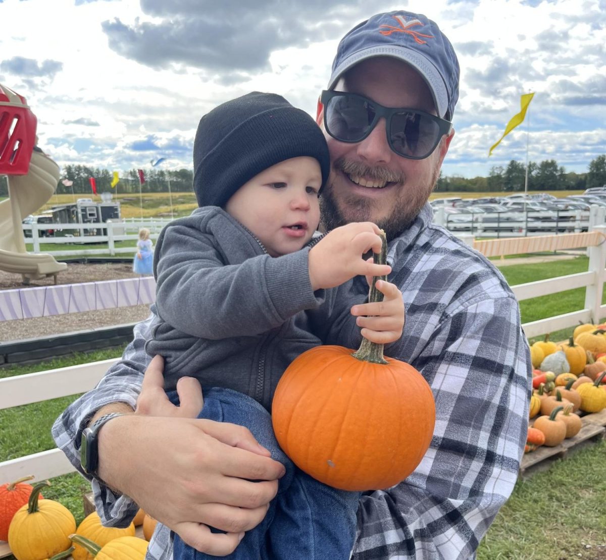 Student Activities and Engagement Coordinator Brad Burzumato holds his son in a pumpkin patch. Photo courtesy of Brad Burzumato.