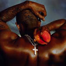 The cover of “Coming Home” shows Usher’s back with the chain of a cross, as well as him holding a peach. This hints at his journey making it to the title of “King of R&B” through determination and with the help of God. Photo Courtesy of Gamma Records.