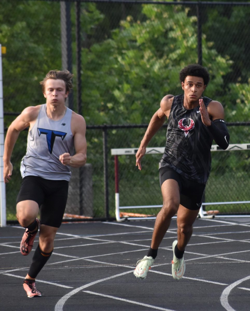  Senior Teyany Kleiner looks to take the lead away from a Huskies runner and a Wolverines runner. Kleiner became the regional runner-up after racing in the 100 and 200 meter.