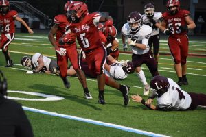 Junior Xavier Smith, a wide receiver/defensive back, breaks a tackle. Smith ended the day with 59 rushing yards and six receiving yards.