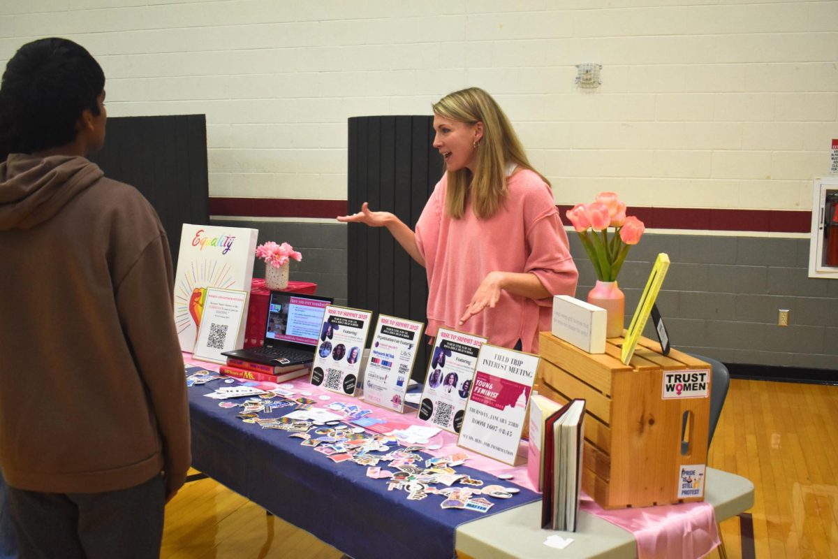 English teacher Jessica Berg informs a student about the Women and Gender Studies elective.