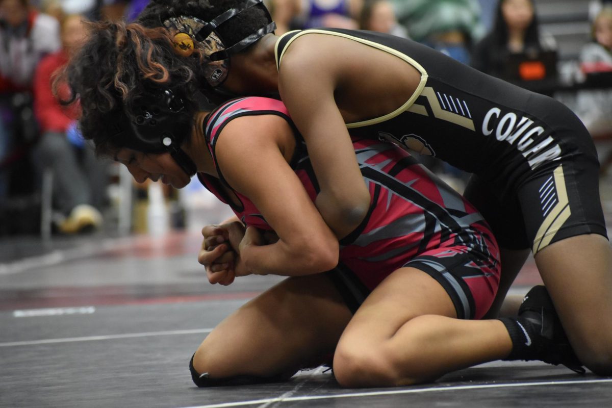 Sophomore Betsy Polanco fights to break free of her opponent's grasp during the “King of the Rock” tournament.