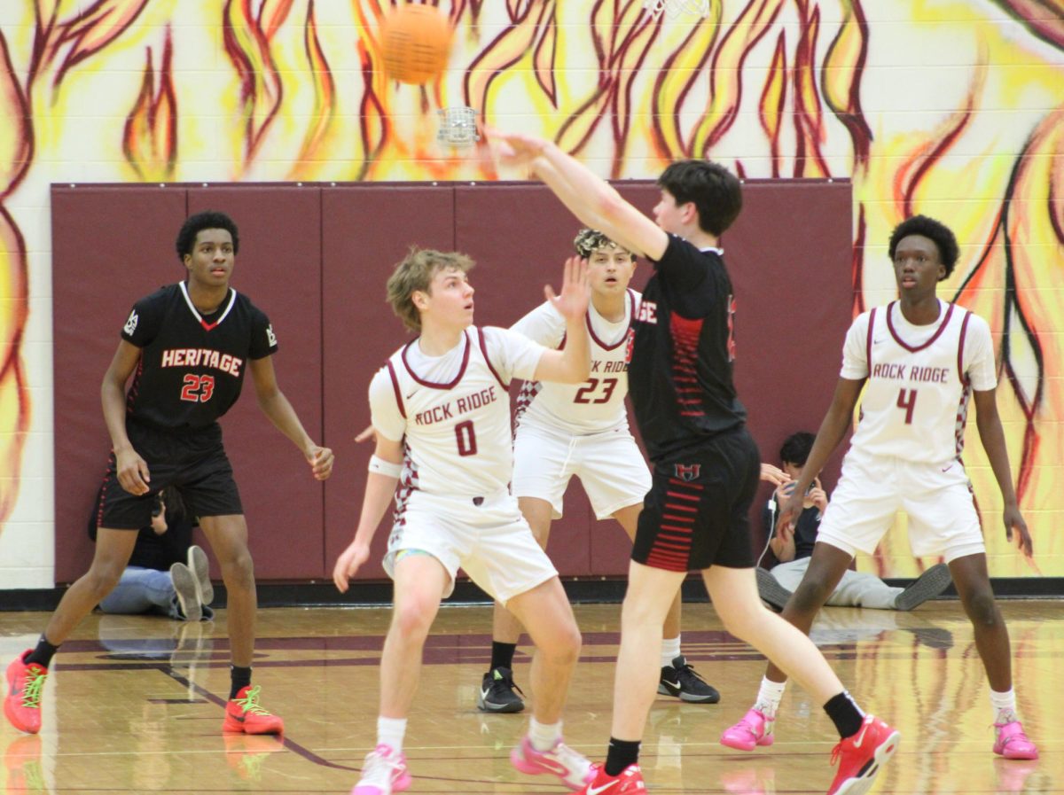 Senior and captain Will Beck defends his opponent and tries to stop the Pride guard  from getting closer to the Phoenix basket.