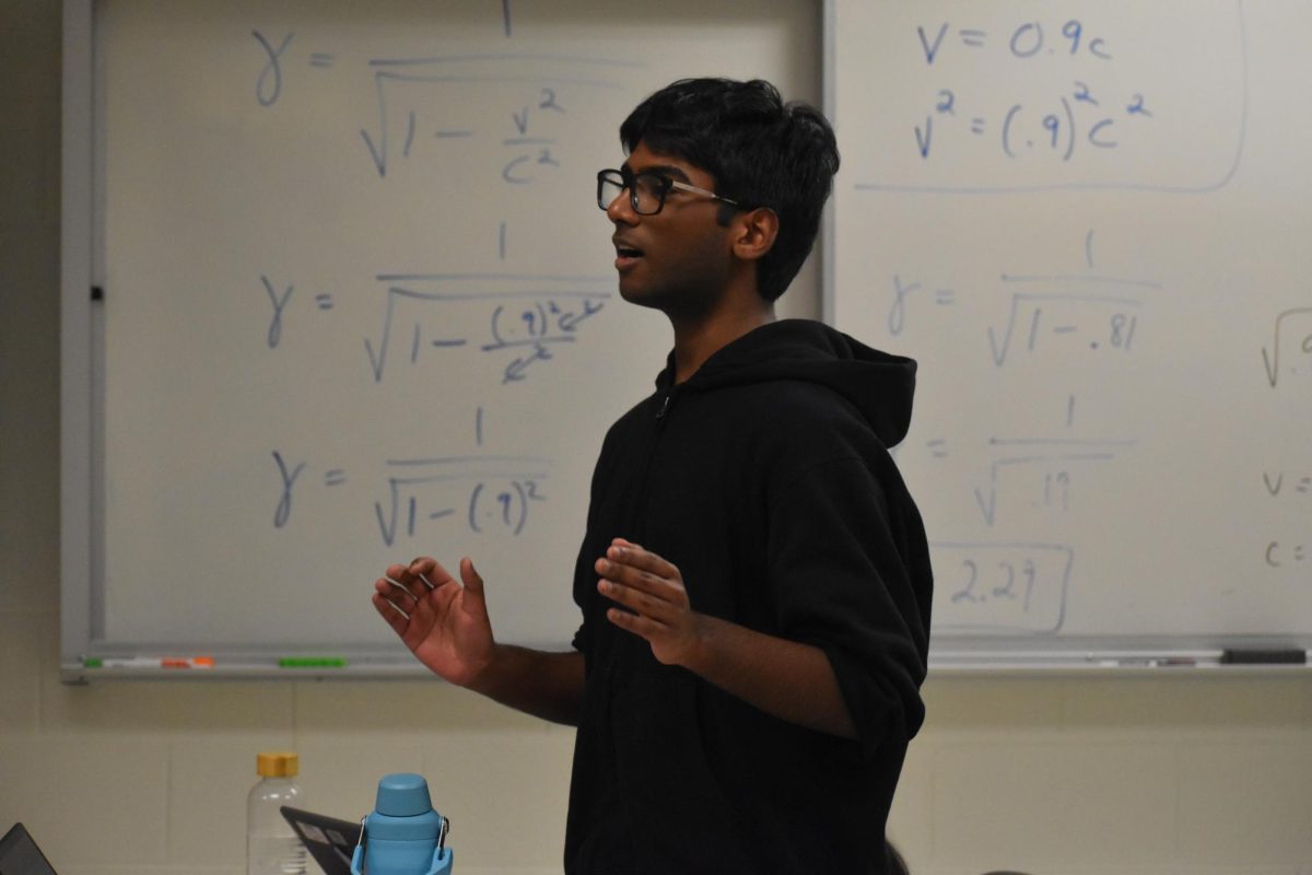 Freshman Sriram Chiripurapu animatedly delivers his rebuttal speech during a mock debate at one of the Public Forum practices. 