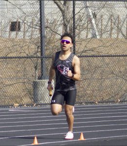 Senior Yug Kolla runs a leg in the boys distance 4x800 in the regional track meet hosted by Rock Ridge. 