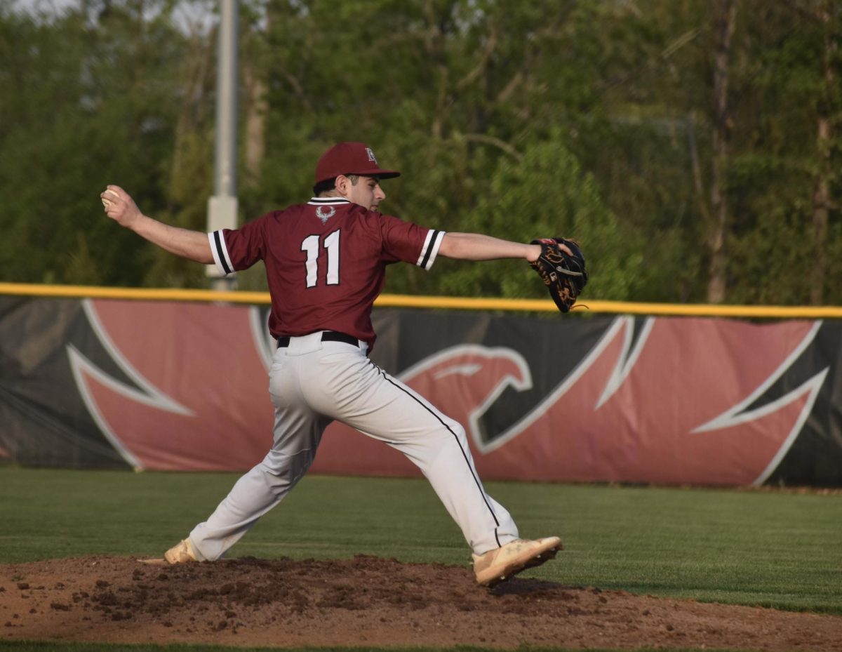 Junior Alex Alkhal pitches the ball. “[I] just let it go and keep practicing so we can focus on our goal for the next game to get better as a team,” Alkhal said.
