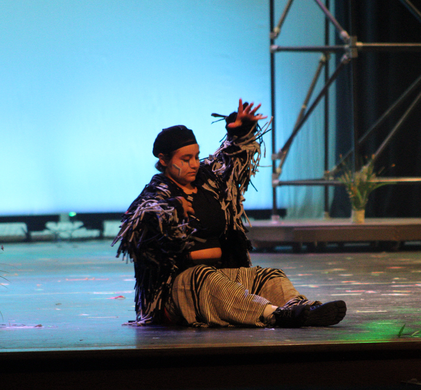 Senior Isabella Hasbun puts her costume on, getting ready and into character before the rehearsal. 