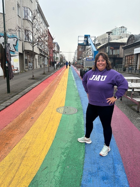 Assistant Principal  Jennifer Cavanaugh smiles while standing on Rainbow Street on a trip to Reykjavik, Iceland.