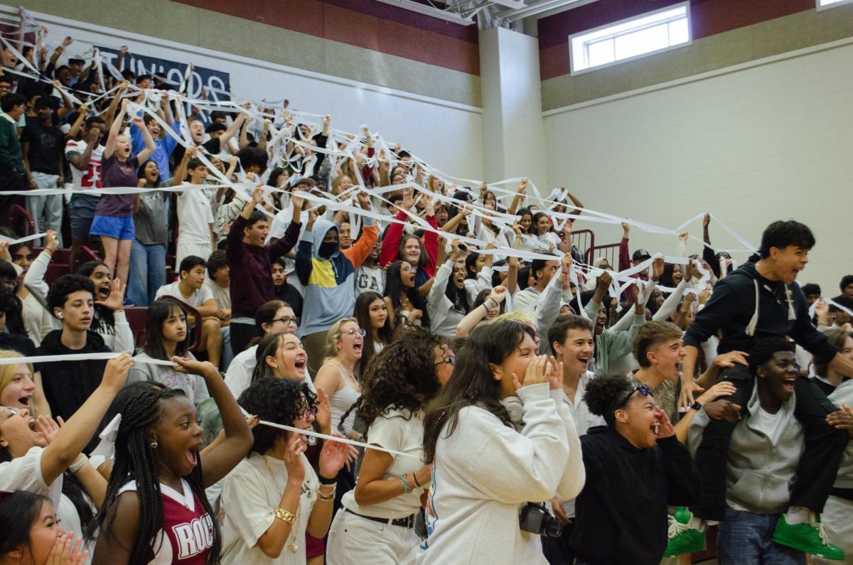 Juniors stand united as they cheer for the chance to win a spirit stick. 