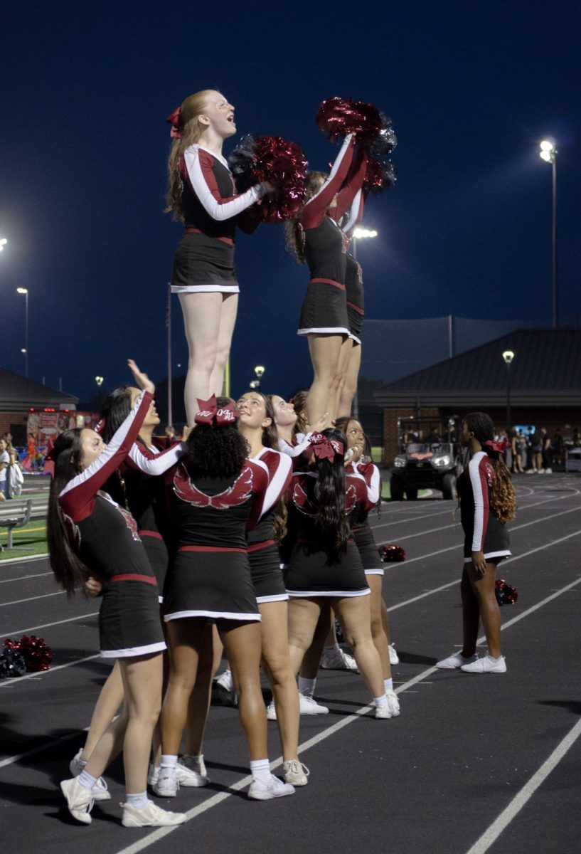 Phoenix cheer brings the hype into the student section, rallying them up.