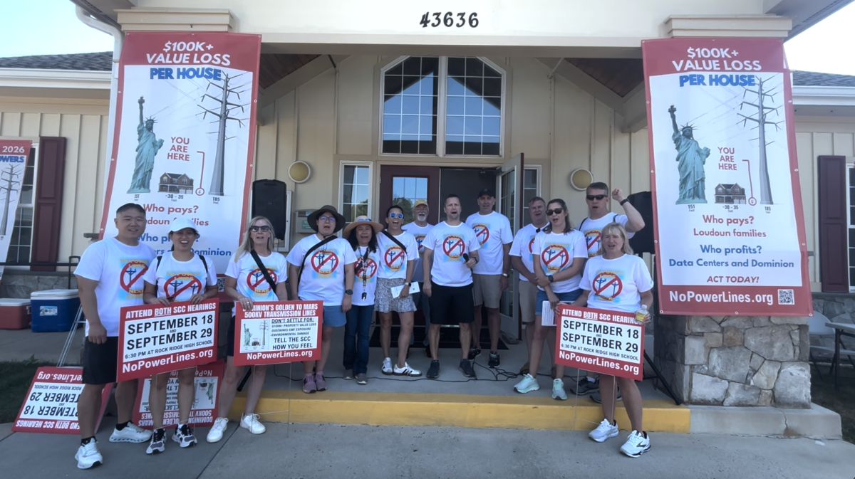 Community members gather together at the September 13th power line rally, wearing shirts that read “No Power Lines Near Homes.”