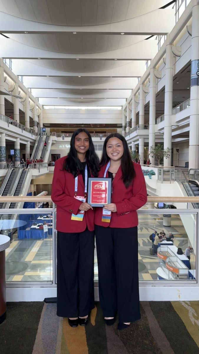 Second-place winners, senior Answesha Rout and senior Kaelyn Alimusa, celebrate their performance at the FCCLA national tournament.